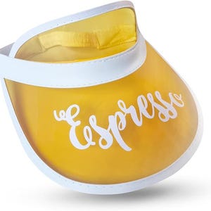 May include: A yellow visor with a white trim and band. The visor features the word "Espresso" in white script. The visor is made of a clear, flexible material.