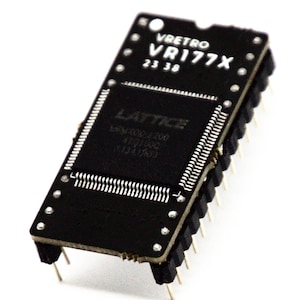 May include: A black rectangular circuit board with the text "vretro VR177X 23 38" printed in white. The board has a central square component with the "LATTICE" logo and other text. It features numerous pins along the edges.