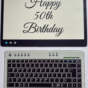 May include: A birthday card featuring a computer monitor design with the words "Happy 50th Birthday". Below, a keyboard design is visible, suggesting a tech-themed birthday celebration.
