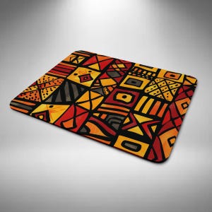 May include: A rectangular mat with a vibrant, geometric pattern in shades of red, orange, yellow, and black. The design features a patchwork of shapes, including triangles, squares, and lines, creating a bold, abstract design. The mat is likely for home decor.