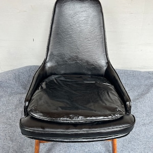 A Mid Century Modern Vintage Danish Black Leather Armchair