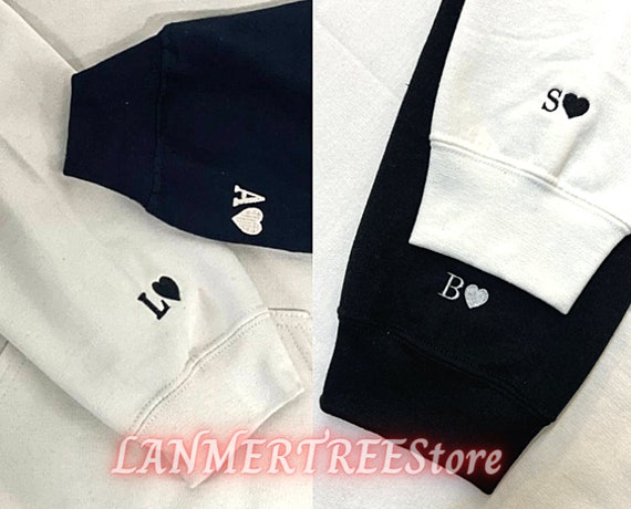 sweatshirt with initial on sleeve