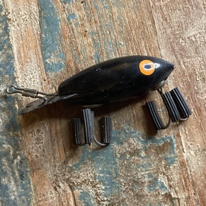 Vintage wooden fishing lure ~ hand painted black fish orange eyes ~ LUXON  Bomber Bait Company outdoor recreation collectible