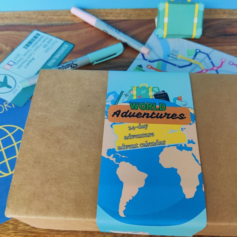 This photo has a box that says World Adventure 24-day adventure Advent calendar. Below is a toy passport, plane ticket and a map.