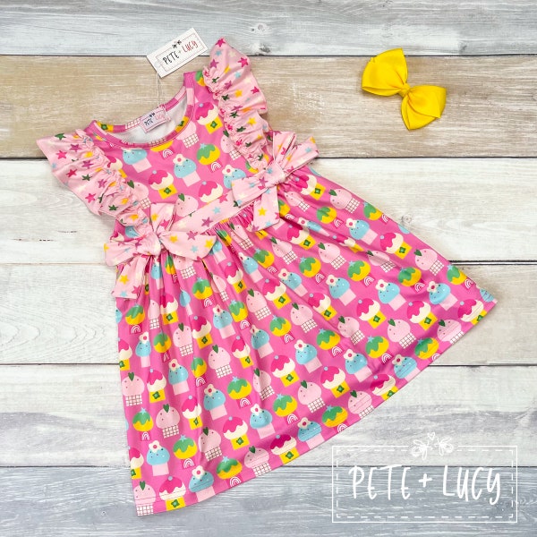 Cute as a Cupcake Girls Ruffled Dress with Flutter Sleeves and Accent Bows (Cupcake and Stars Design)