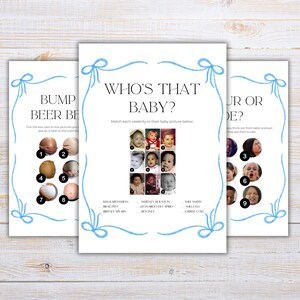 May include: Three white paper game sheets with blue ribbon accents. The games are titled "Bump Beer Be," "Who's That Baby?" and "Your or Ride?" The "Who's That Baby?" game features baby photos.