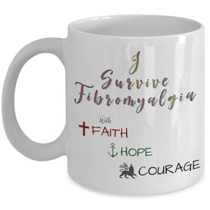 May include: White ceramic mug with a curved handle. The mug features the text "I Survive Fibromyalgia" in colorful script, along with the words "Faith," "Hope," and "Courage" and related symbols. A thoughtful gift.
