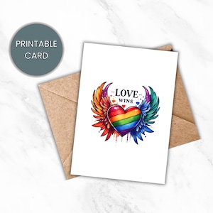 Carte de fierté imprimable - Cœur arc-en-ciel avec des ailes - Célébrez l'unité LGBTQ+ avec la carte « L'amour gagne » - Téléchargement numérique instantané - Carte du mois de la fierté