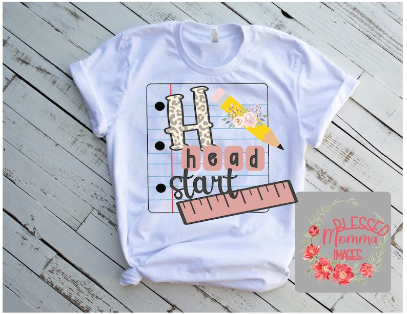 May include: White t-shirt featuring a graphic design of a pencil, ruler, and the words "Head Start" on a sheet of notebook paper. The graphic is in a school theme with leopard print, flowers, and a pink ruler.