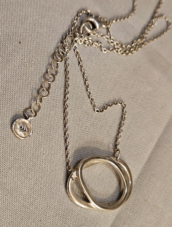 Sterling silver, double circle design necklace. "S