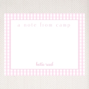 May include: A pink and white gingham stationery card with the text "a note from camp" and the name "katie reed" at the bottom.