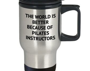 May include: Stainless steel travel mug with a black lid and handle. The mug has the text "The world is better because of Pilates instructors" printed on it.