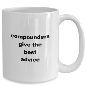 May include: White ceramic coffee mug with black text that reads "Compounders give the best advice".