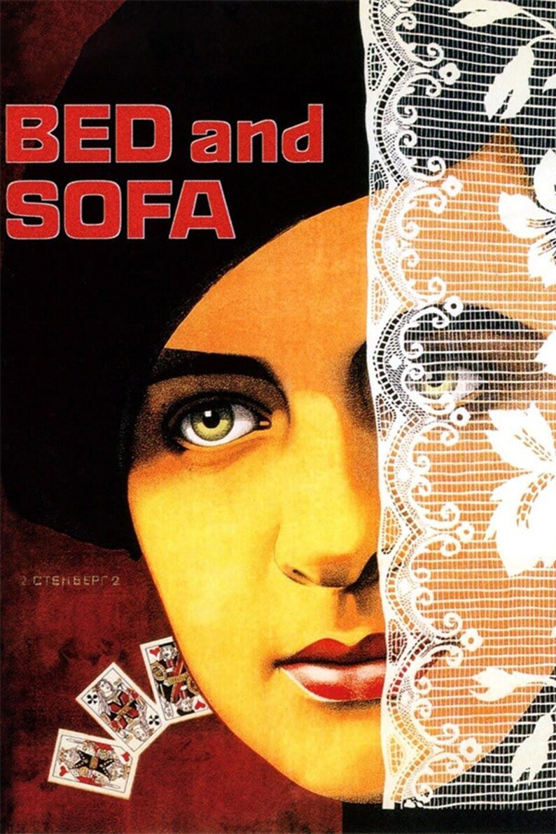 May include: A vintage movie poster for the film "Bed and Sofa" featuring a woman's face partially obscured by a white lace veil. The title of the film is in red letters against a black background.