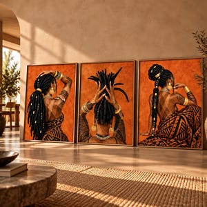 May include: A set of three framed wall art prints featuring portraits of a person with dark skin, black locs, and intricate tattoos. The person wears gold jewelry and patterned clothing against a textured orange background in each piece.