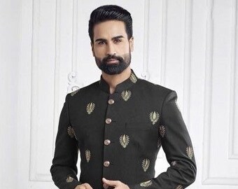 May include: A black suit with a mandarin collar and gold embroidery. The suit includes a jacket and pants. The jacket has a button closure and the pants have a straight leg.