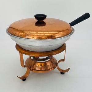 Vintage koperen komfoor met standaard