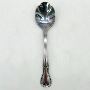 May include: A set of three ceramic mugs with a speckled, matte finish. The mugs are in shades of cream, light gray, and dark gray. Each mug has a simple, minimalist design, perfect for coffee or tea.