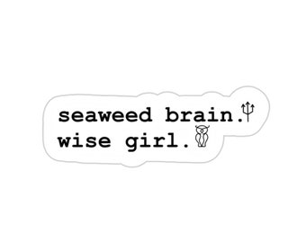 May include: A sticker with the text "seaweed brain. wise girl." and a small illustration of an owl and a trident.
