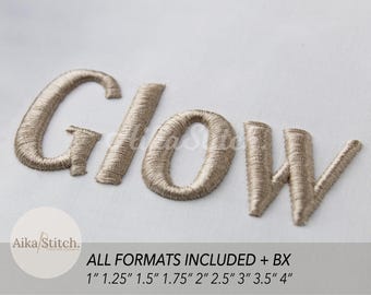 May include: The word GLOW is embroidered in a metallic beige thread on a white fabric background. The text AikaStitch is visible in a circular logo. Text below states ALL FORMATS INCLUDED + BX and lists sizes 1, 1.25, 1.5, 1.75, 2, 2.5, 3, 3.5, 4 inches.