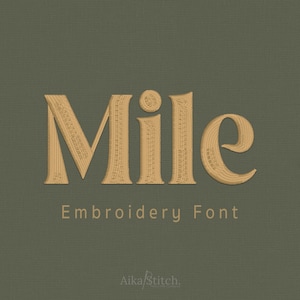 May include: The word Mile is displayed in a tan, textured embroidery font against a solid olive green background. Below the word, the text Embroidery Font is written in a smaller, simple font, followed by the brand name Aika Stitch at the bottom.