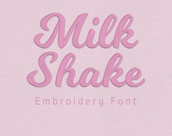 May include: A digital display of the Milk Shake Embroidery Font in a soft pink color against a light pink textured background. The text Milk Shake is written in a bold, cursive script, with the words Embroidery Font and Aika Stitch below.