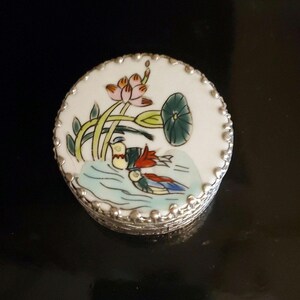 Silver tone box with porcelain top