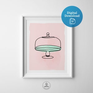 Kitchen wall art of cake stand with blue plate on pink background. Shown in frame.