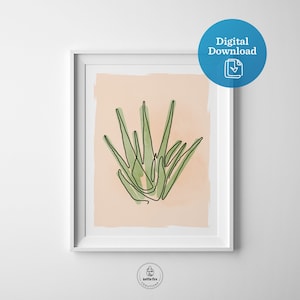 Printable wall art of green aloe plant on tan background. Shown in frame.
