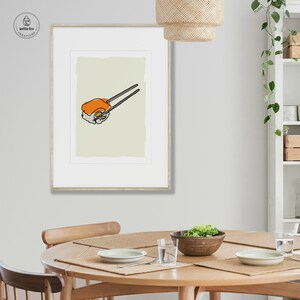Kitchen wall art line drawing of sushi with orange and gray on an off-white background. Shown in kitchen.