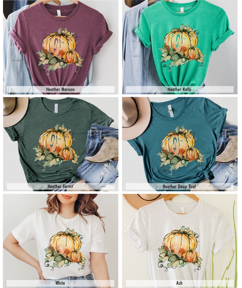Może przedstawiać: Zestaw sześciu koszulek z nadrukiem akwarelowej dyni. Koszulki są dostępne w kolorach Heather Maroon, Heather Kelly, Heather Forest, Heather Deep Teal, White i Ash.