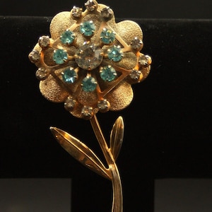 Vintage blue rhinestone flower brooch