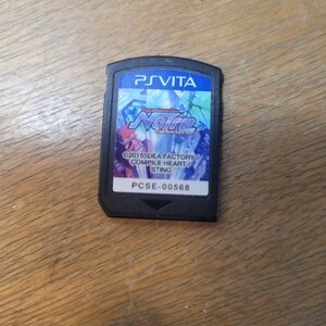May include: A black PS Vita game cartridge with the title "Noire" in blue and red. The cartridge has the PS Vita logo at the top and the text "©2015 IDEA FACTORY / COMPILE HEART / STING" at the bottom.