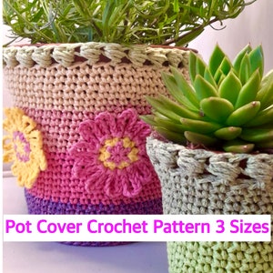 May include: Two crocheted plant pot covers in different sizes. The larger pot cover is pink, purple, and beige with a yellow flower. The smaller pot cover is green and beige. The text "Pot Cover Crochet Pattern 3 Sizes" is at the bottom of the image.