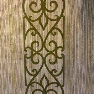 May include: Wallpaper featuring a repeating vertical pattern of olive green scrollwork and filigree motifs set against a textured background of alternating light tan and white vertical stripes, creating a structured and symmetrical visual design.