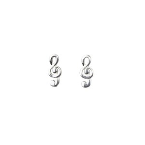 May include: A pair of silver treble clef stud earrings. The earrings are small and delicate, perfect for adding a touch of music to any outfit.