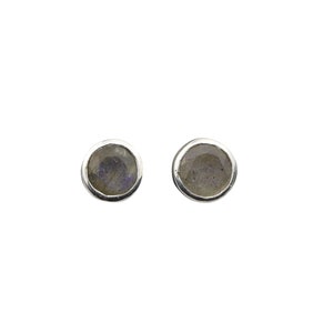 May include: A pair of silver stud earrings with round, iridescent labradorite gemstones.