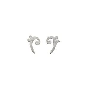 May include: A pair of silver-coloured stud earrings shaped like treble clef symbols. The earrings have a textured surface and are set against a white background. These musical-themed earrings are a stylish accessory.