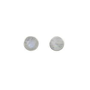 May include: A pair of silver stud earrings with round moonstone gemstones.