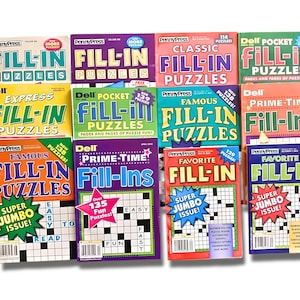 May include: A collection of nine different magazines featuring fill-in puzzles. The magazines have colorful covers with titles like "Classic Fill-in Puzzles", "Famous Fill-in Puzzles", and "Prime-Time Fill-Ins".