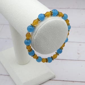 Stretch bracelet with sky blue quartz, light brown bicone beads with gold tone accents, Gift for Her, Blue and Brown stretch braclet