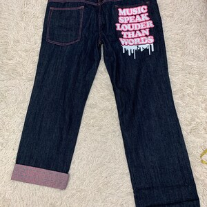 Size 40: Vintage 2000 Rimaster baggy jeans hiphop ‘music speak louder than words’
