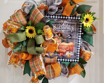 and stuffed owl embellishment. pumpkin picks Beautiful fall front door wreath on a grapevine with fall plaid ribbons Scarecrow pick
