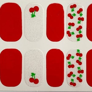 May include: A set of 10 nail wraps featuring a red cherry design on a white background. Some of the wraps are solid red.