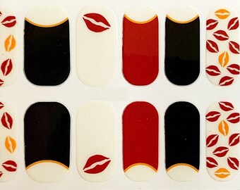 May include: Nail polish wraps with a red and yellow lip print design. The set includes 10 nail wraps, 2 solid red, 2 solid black, 2 white with a red lip, and 4 with the lip print.