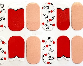 May include: Nail polish wraps with a white background and red hearts with the word "Love" printed on them. There are also solid red and pink nail wraps included.