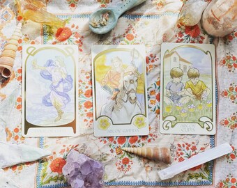 May include: Three tarot cards with colorful illustrations and text. The cards are "Six of Wands", "Six of Cups", and "Six of Swords".