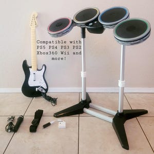 Rock Band Guitar, Drums, Mic Bundle: Multi-Platform Compatible (PS5, PS4, PS3, Xbox360, Wii)