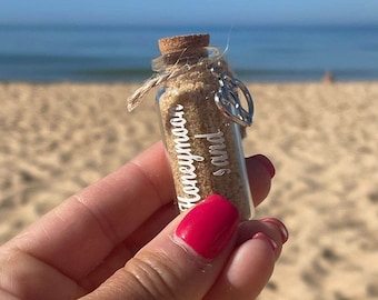Honeymoon sand. Cute mini bottle with a romantic heart attached with twine. Honeymoon or wedding gift and keepsake