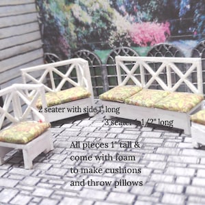 May include: Miniature white wooden furniture set, including a two-seater bench, a three-seater bench, and two chairs. The cushions have a floral pattern. The text on the image says the pieces are 1 inch tall.